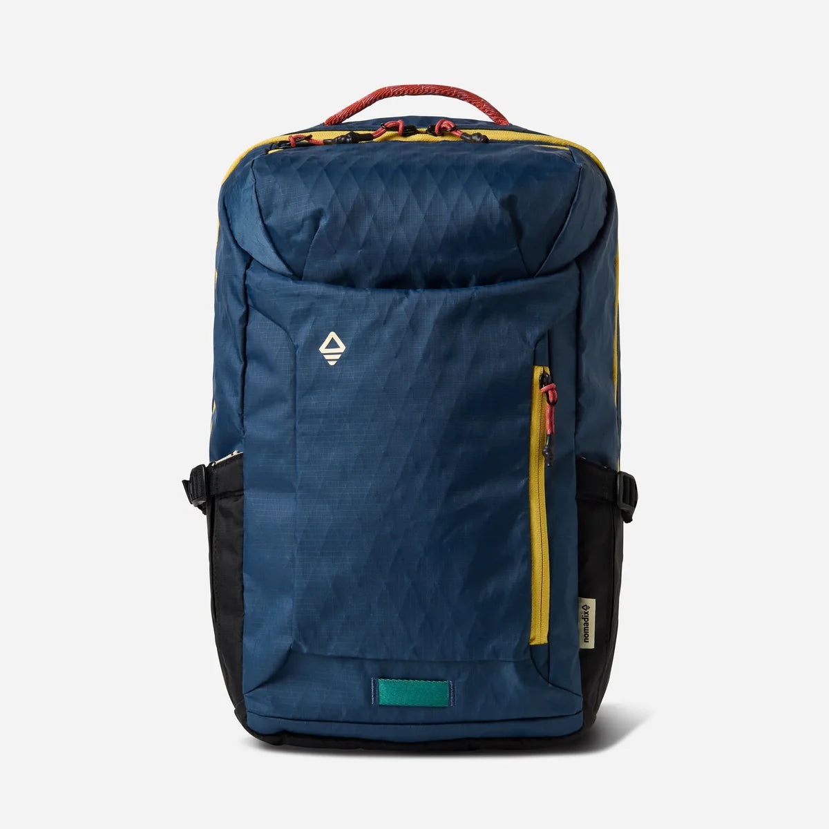 A blue and black backpack with yellow zipper accents, a red top handle, and a small white logo on the front pocket, shown against a light gray background.