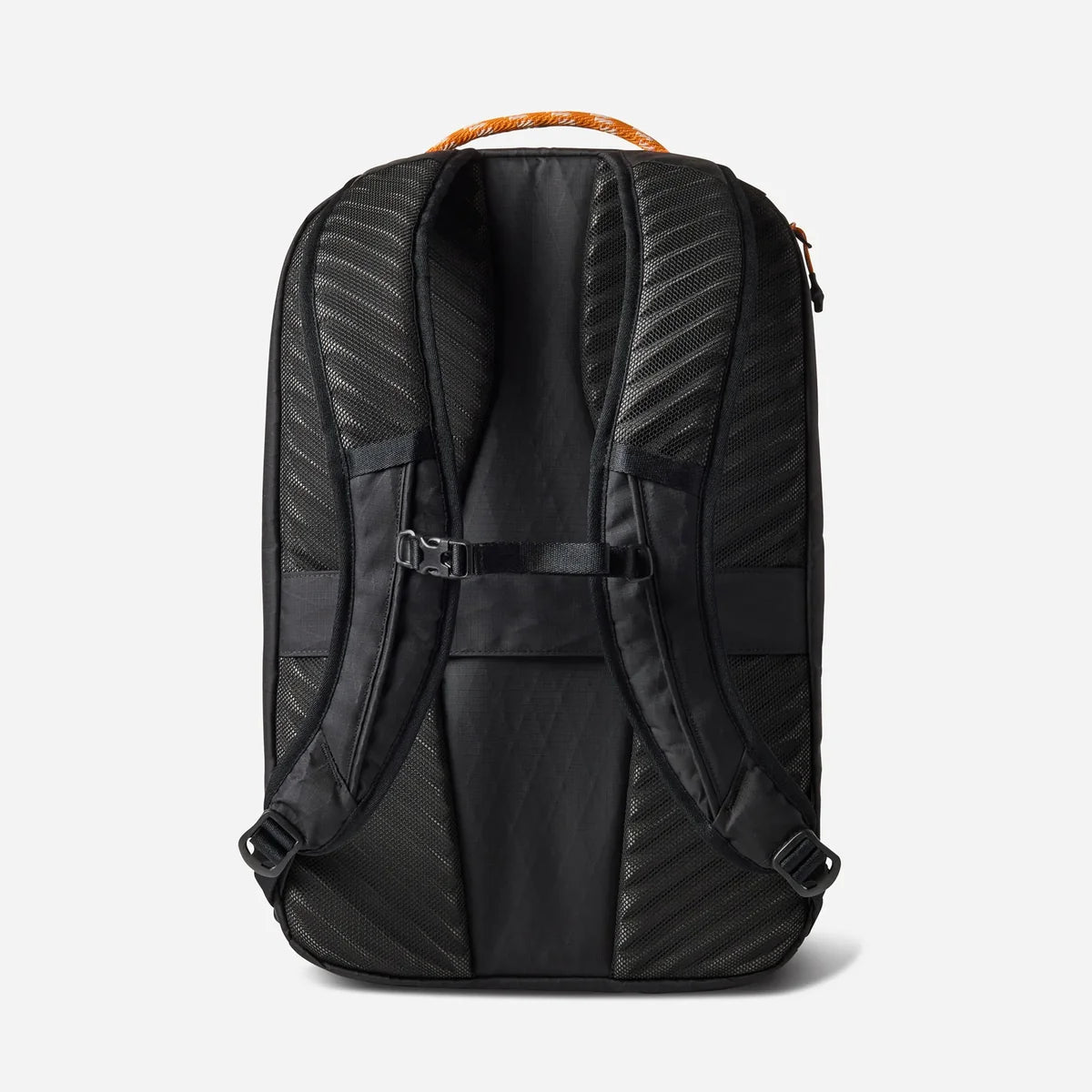 The back view of a black backpack with textured, diamond-patterned padding, adjustable shoulder straps, and an orange top carry handle, shown on a light gray background.