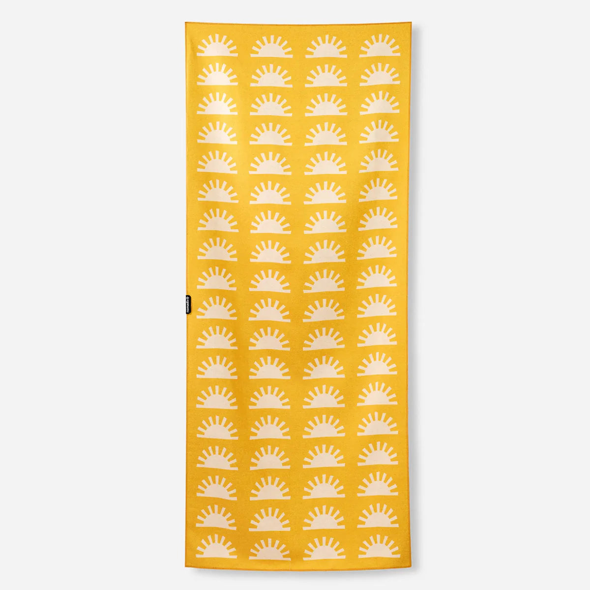 Yellow towel with white sun pattern on a white background
