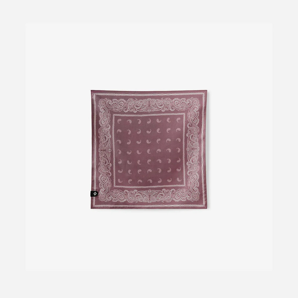 A square dusty rose bandana with a white paisley border and a grid of small white dots, displayed flat against a light gray background.