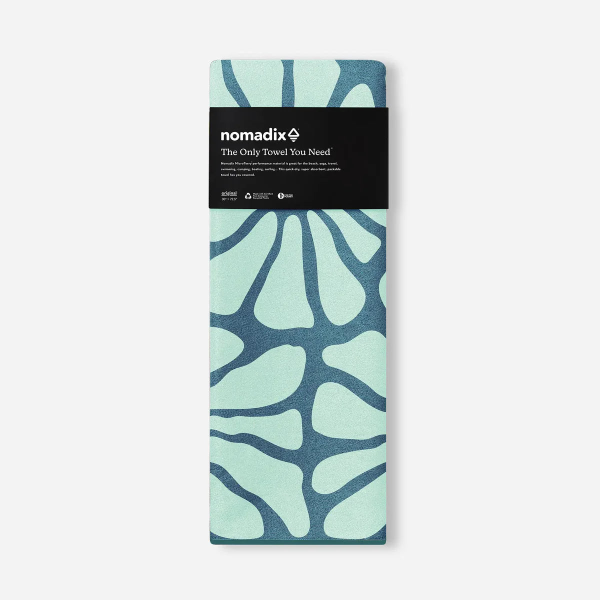 Folded towel with blue and green pattern and 'nomadix' branding on a white background