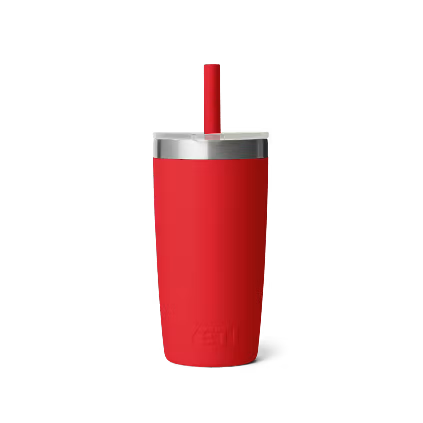 Red tumbler with a silver rim and straw on a white background
