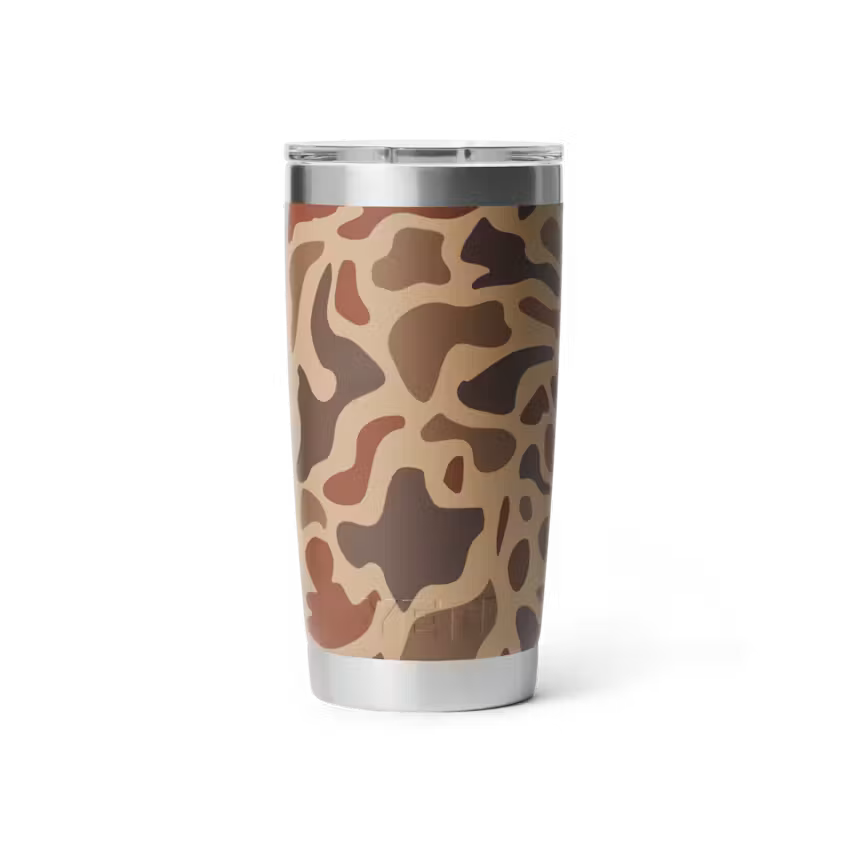 Camouflage-patterned tumbler with a silver rim on a white background