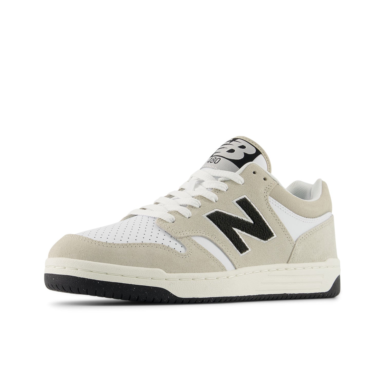 Beige sneaker with black accents on a white background