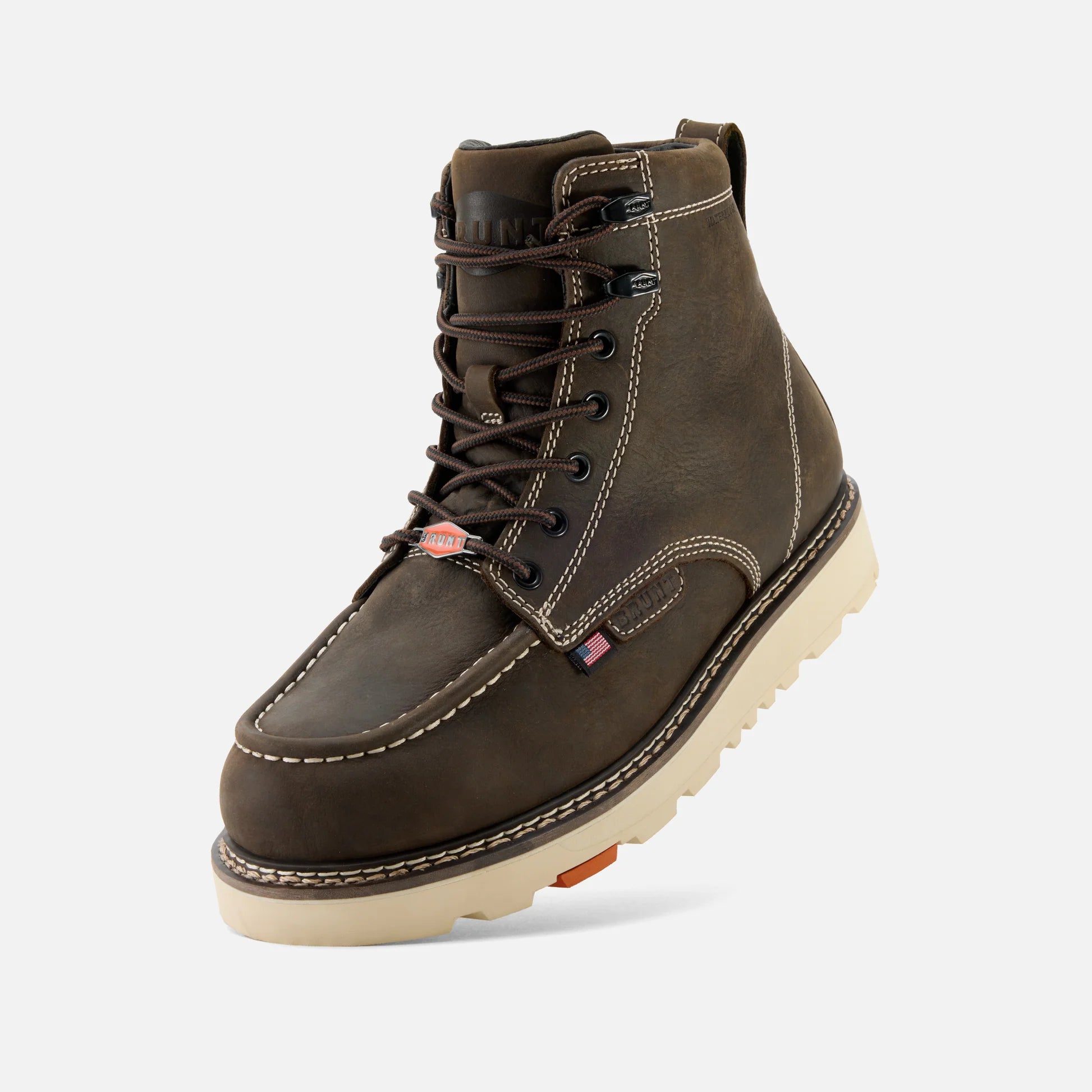 Brown leather boot with a white sole on a light gray background