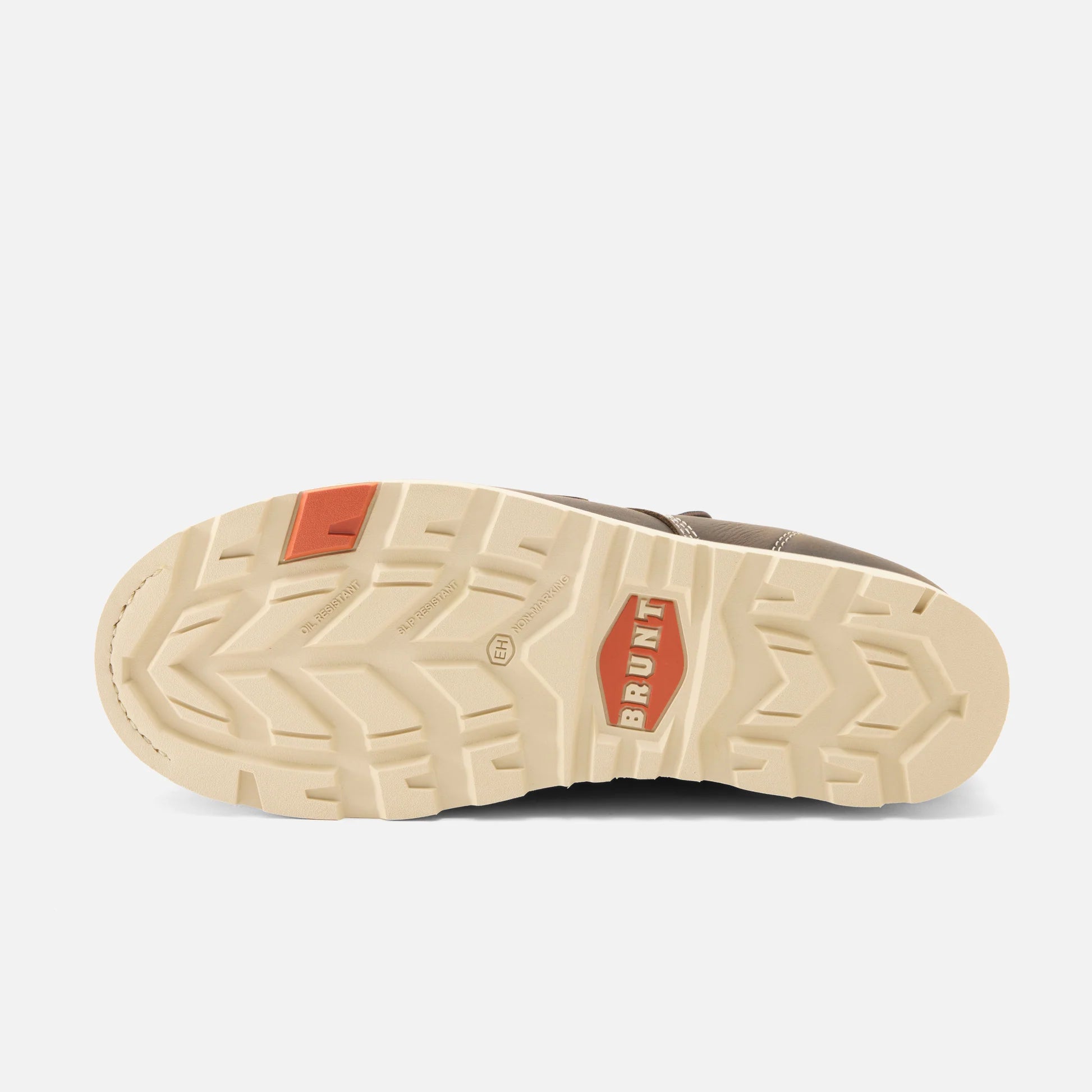 Brown shoe with beige sole and red accents on a white background