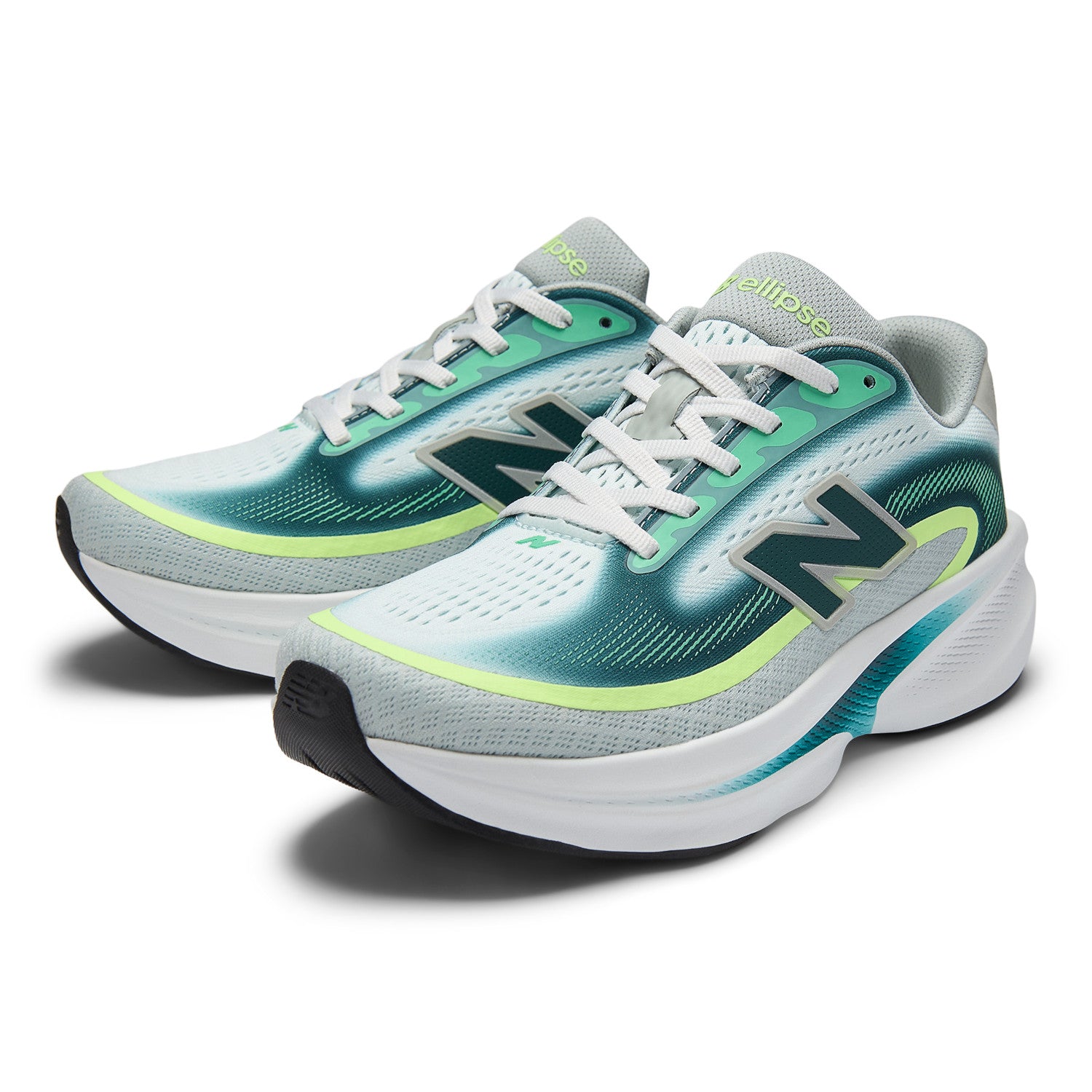Pair of New Balance running shoes with green and gray design on a white background