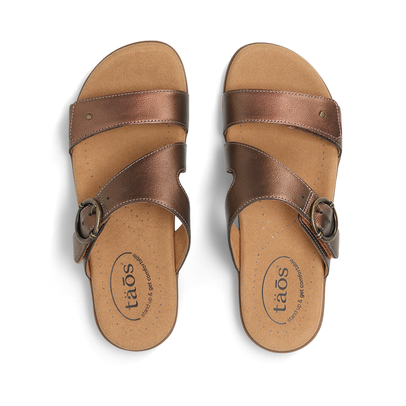 Pair of brown sandals with 'taos' branding on a white background