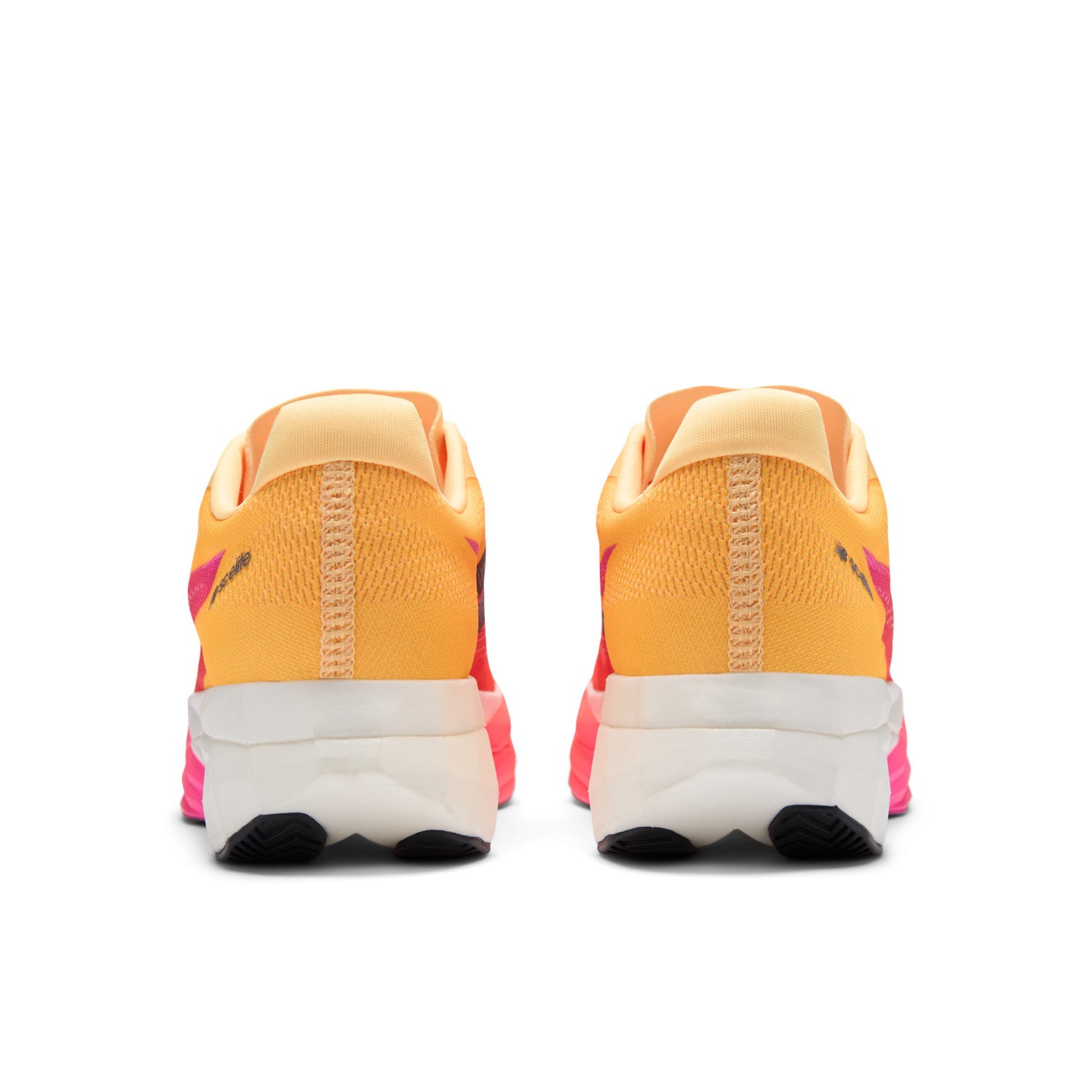 Pair of orange and pink running shoes with white soles on a white background