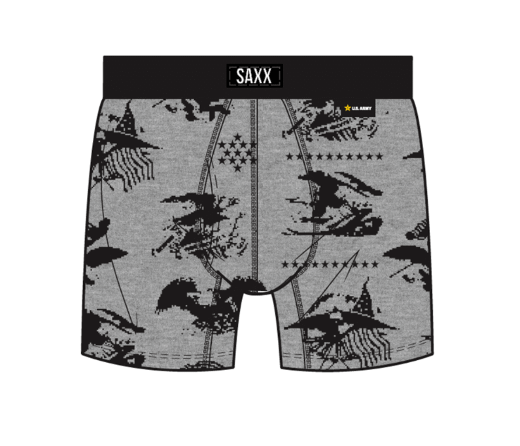 Gray boxer briefs with a black graphic print of witches riding broomsticks, stars, and stripes, featuring a black waistband with the brand name 'SAXX' and a small U.S.