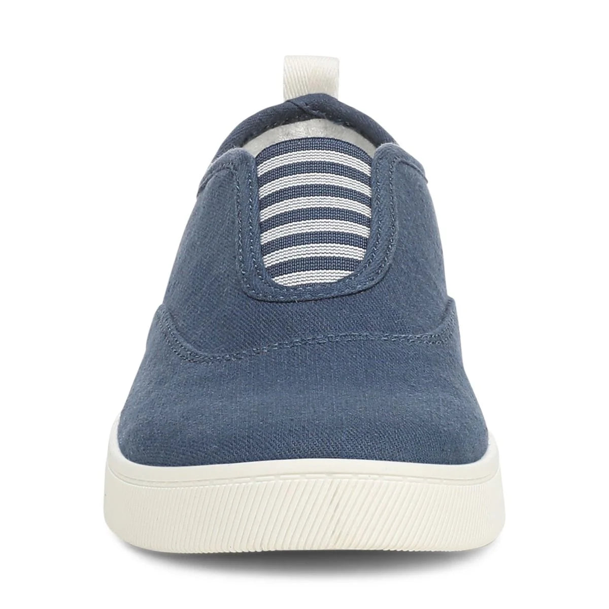 Blue slip-on sneaker with white sole on a white background
