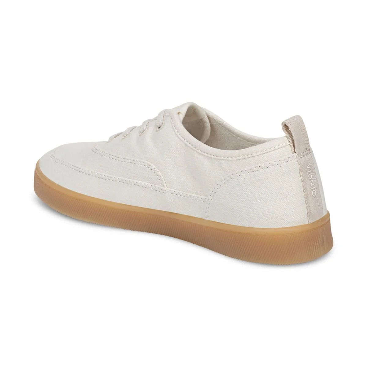 White sneaker with brown sole on a white background