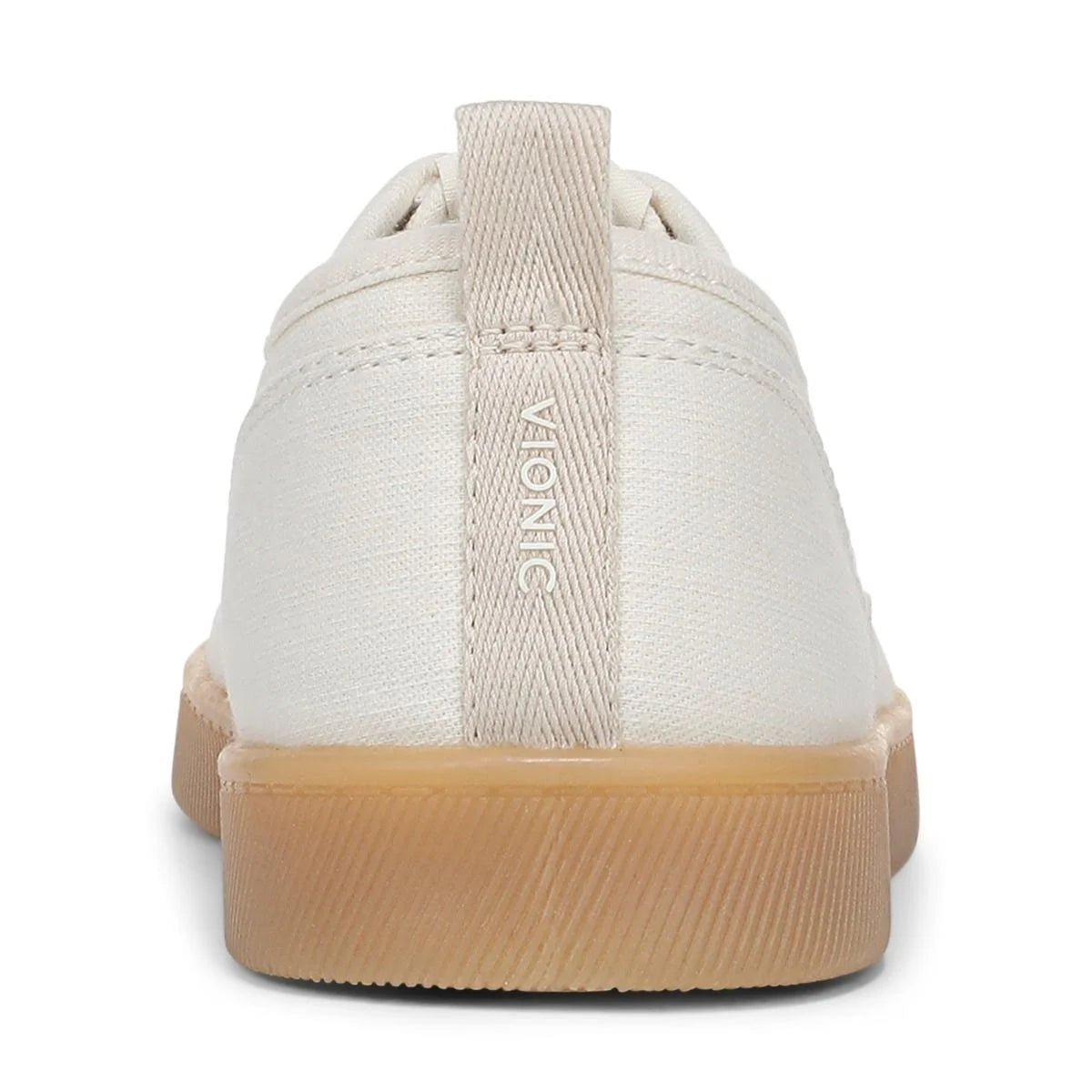White sneaker with brown sole on a white background