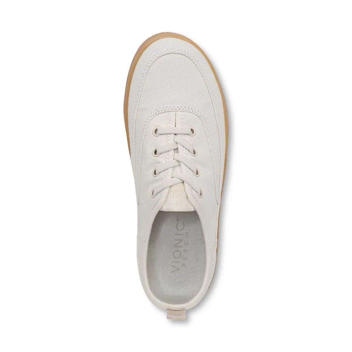 White sneaker with brown sole on a white background
