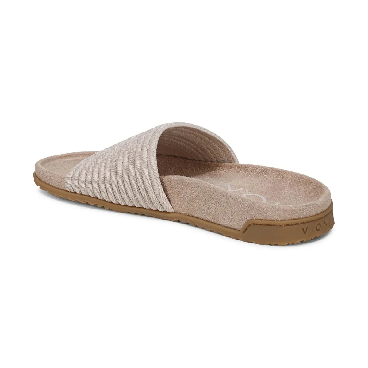 Beige slide sandal with brown sole on a white background