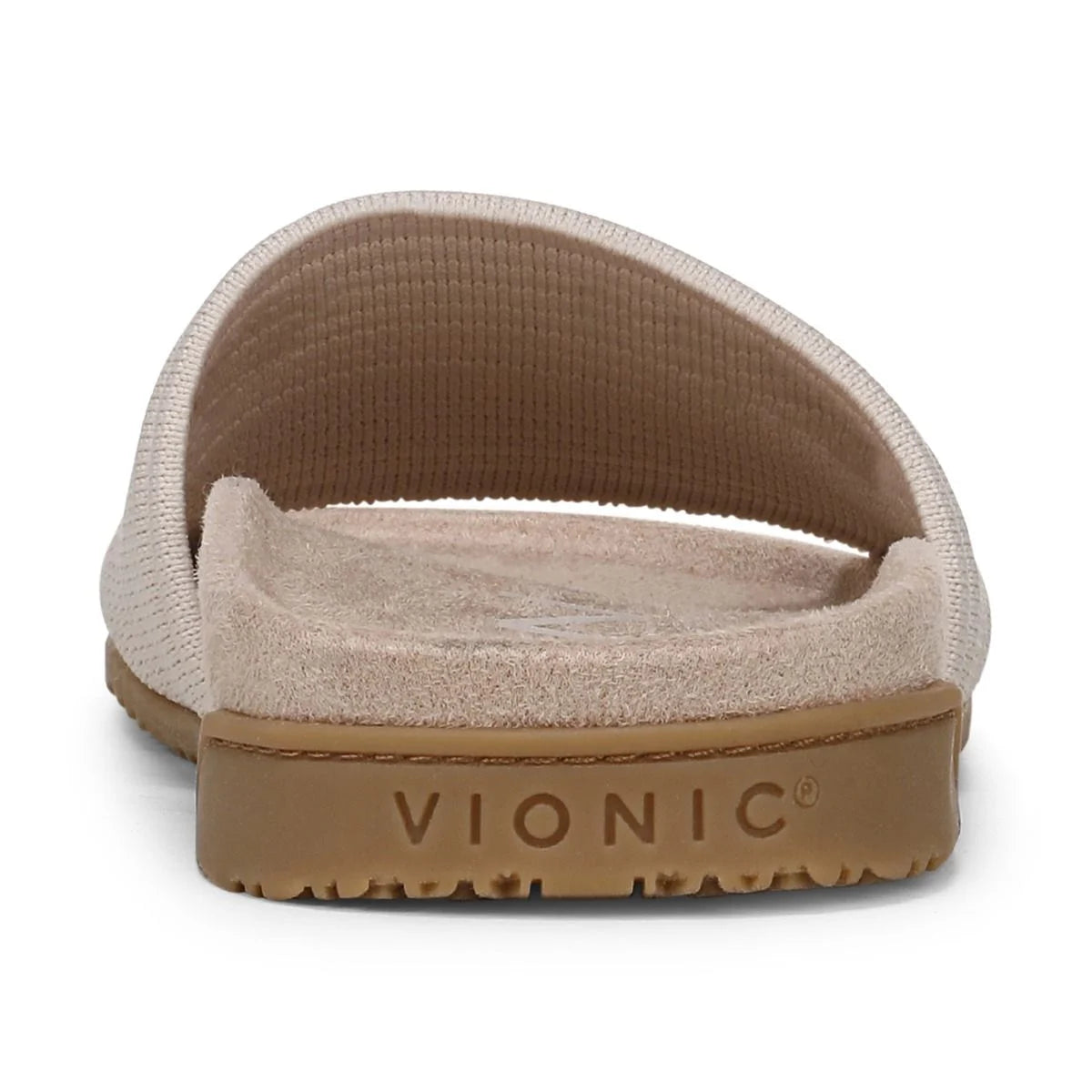 Vionic sandal with beige suede upper and brown rubber sole on a white background