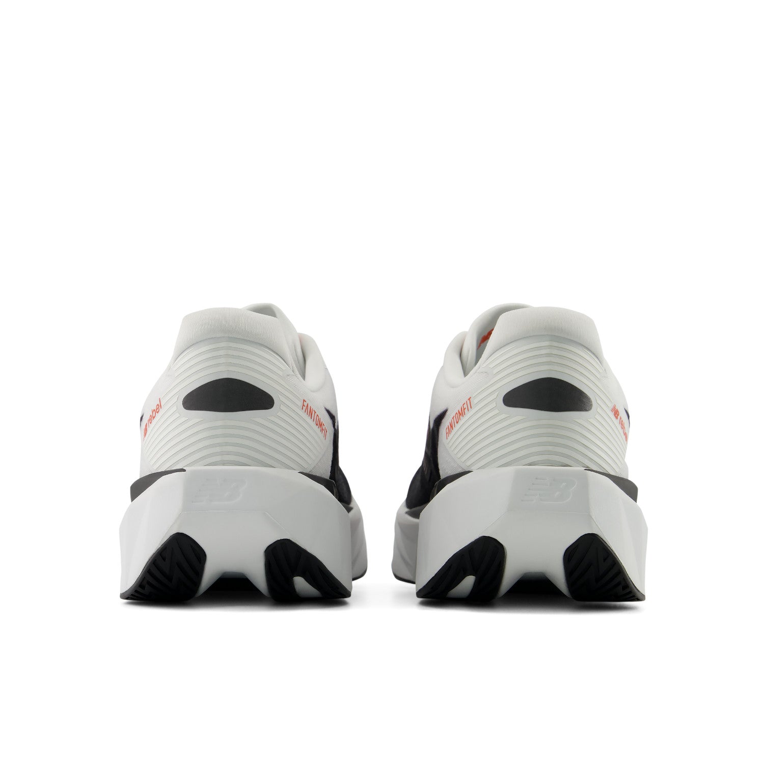 White athletic shoes with black soles on a white background