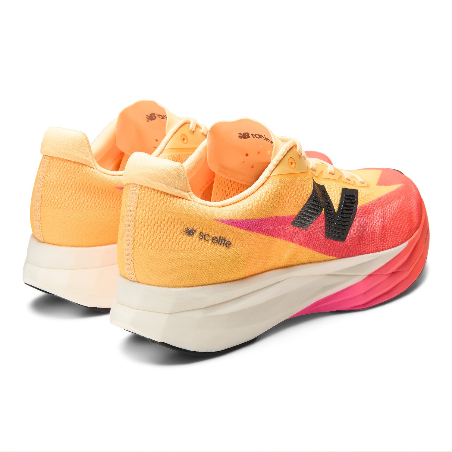 Pair of orange and pink running shoes with a visible brand logo on a white background