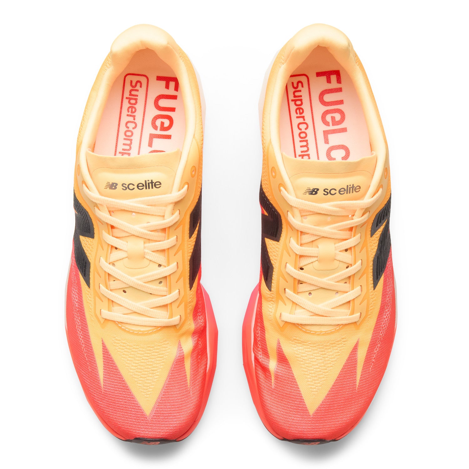 Pair of orange and red running shoes with visible branding on a white background