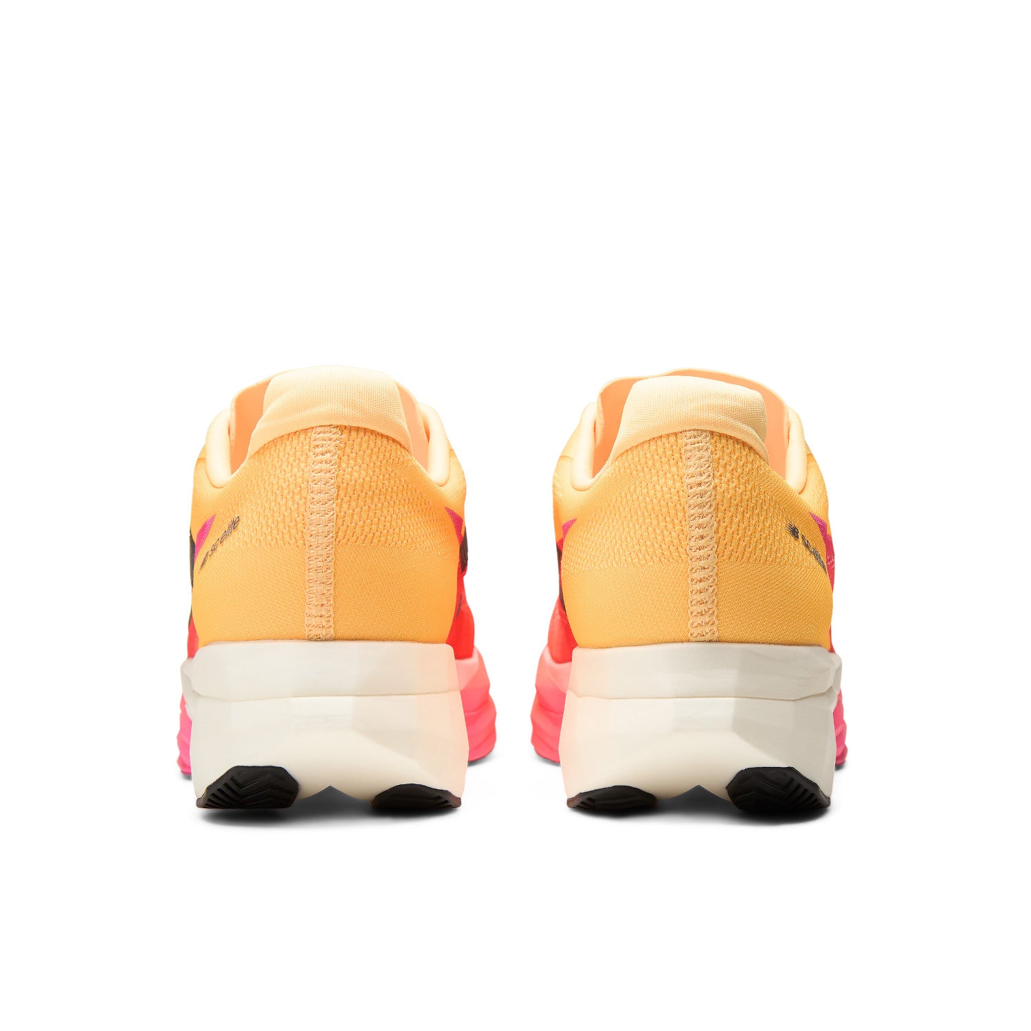 Pair of orange and pink sneakers with a white sole on a white background