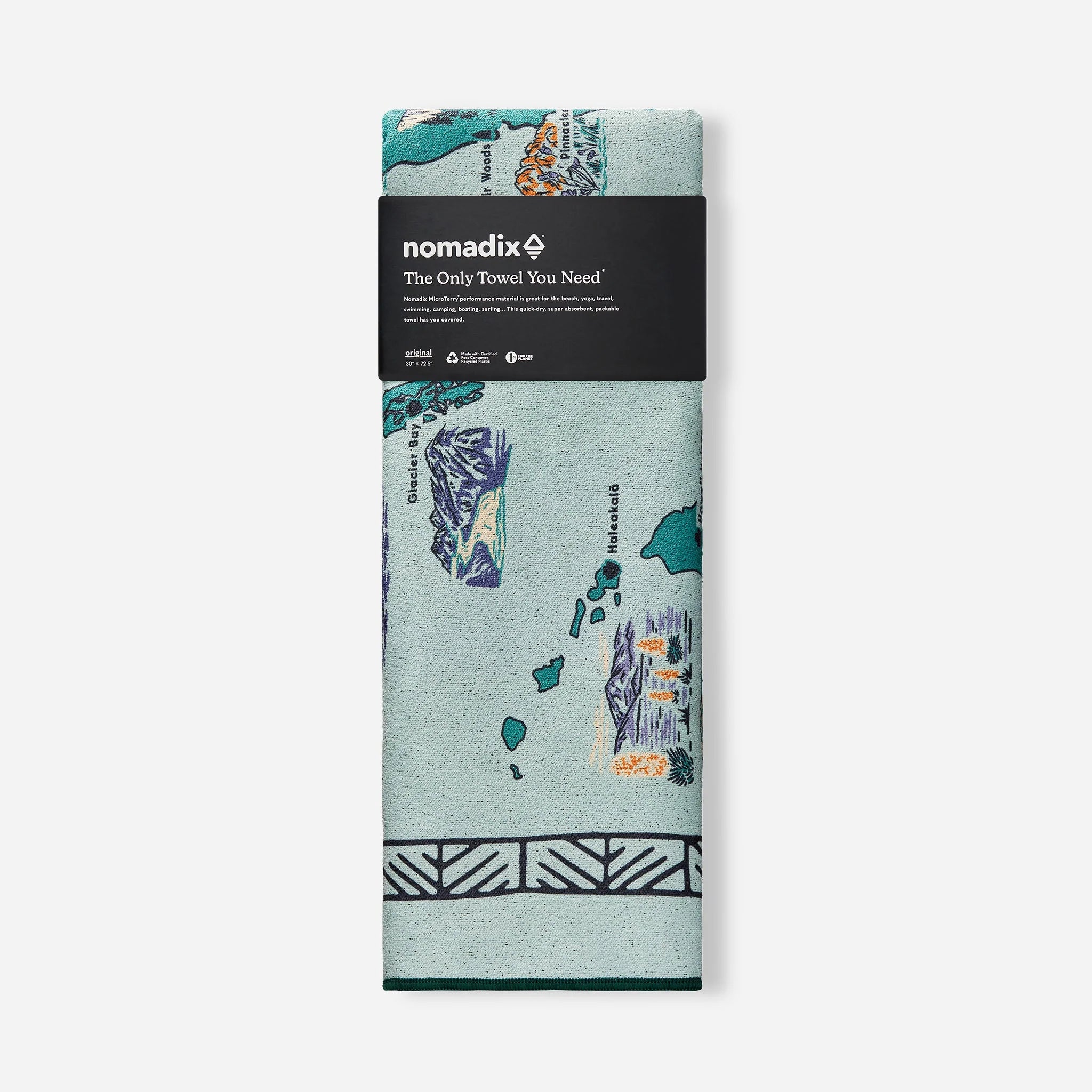 Packaged towel with nature-themed design and 'nomadix' branding on a white background