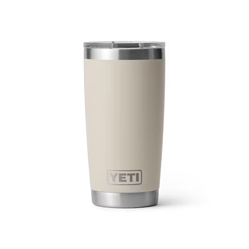 Beige YETI tumbler with silver lid on a white background