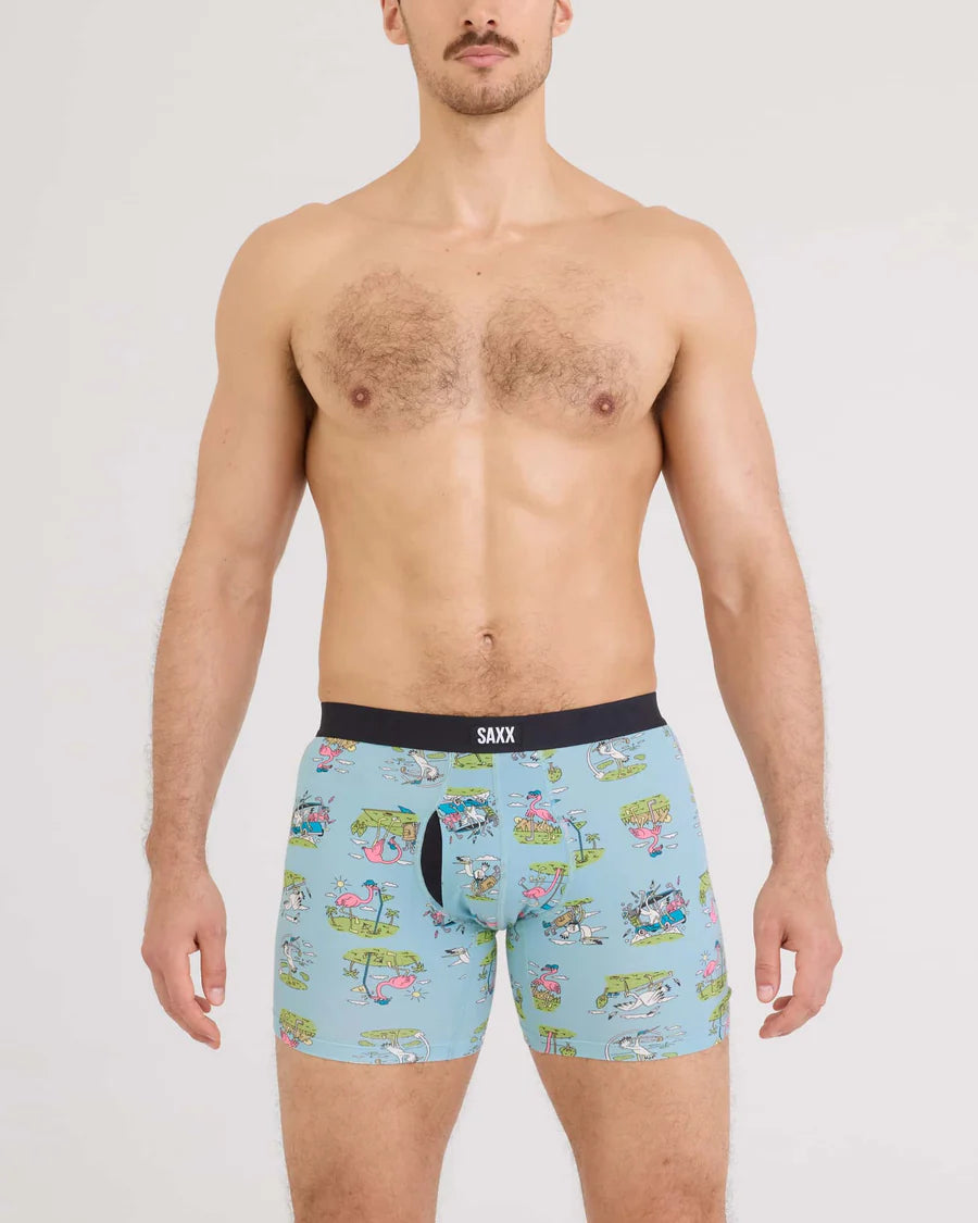 Man wearing light blue boxer briefs with cartoon design on a white background