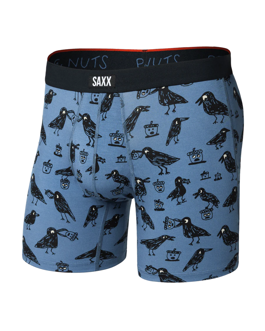 Blue boxer briefs with black crow pattern and Saxx branding on a white background
