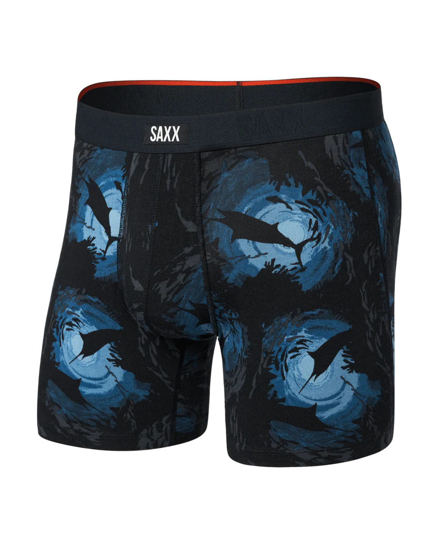 Black and blue patterned boxer briefs with SAXX branding on a white background