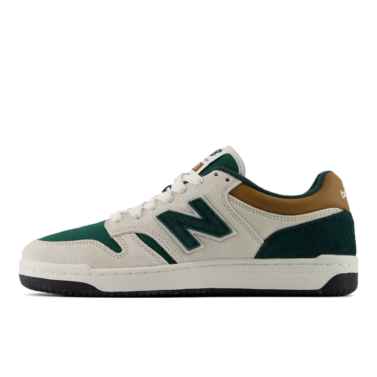 A New Balance sneaker in off-white suede and dark green mesh, featuring a brown leather heel tab and a black outsole, shown in a side profile on a white background.