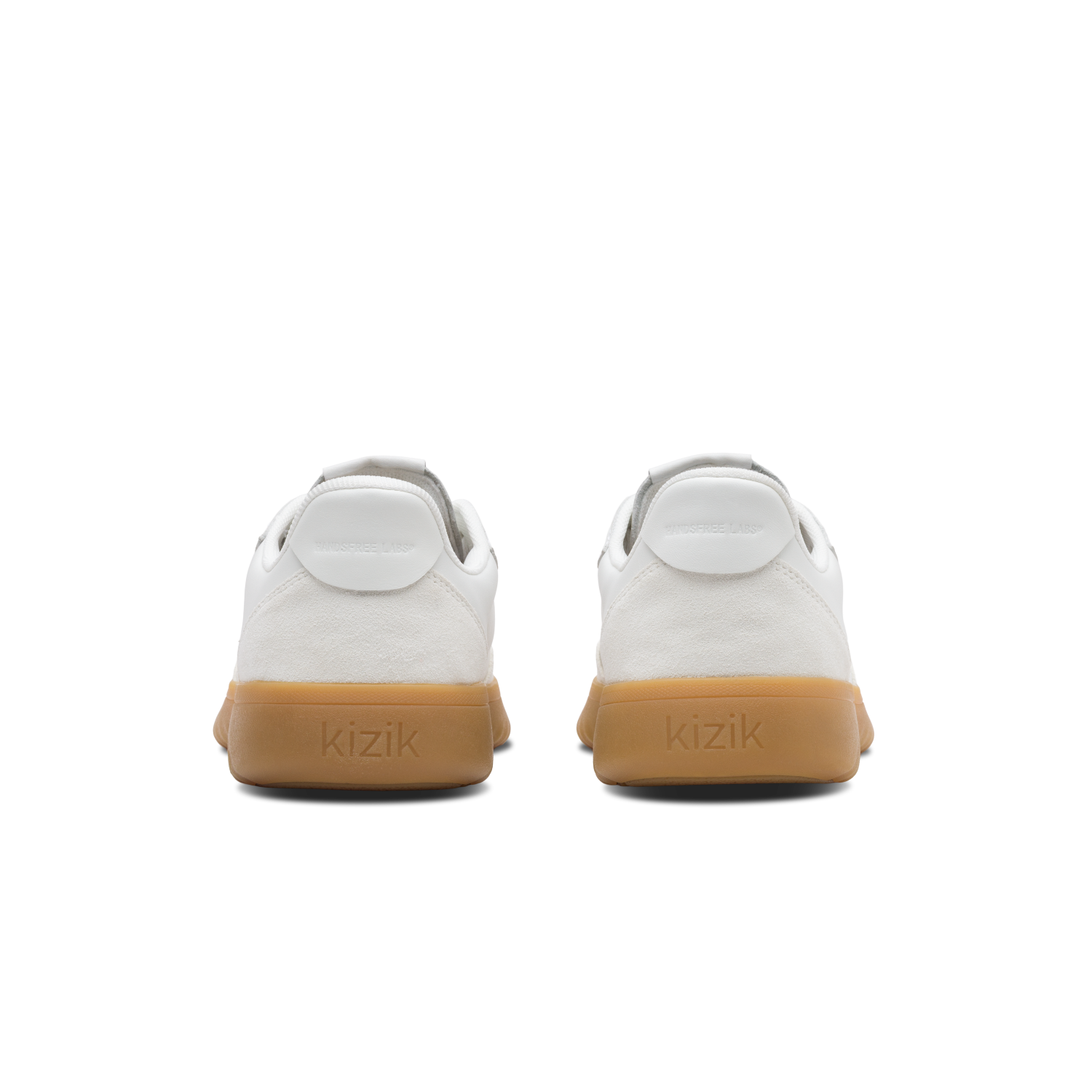 White sneakers with brown soles on a white background