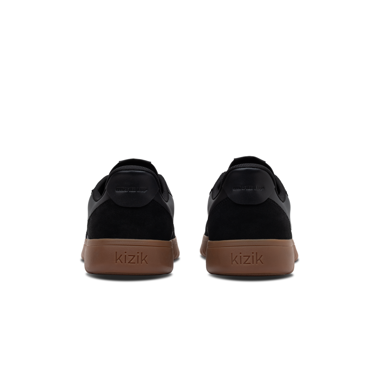 Black sneakers with brown soles on a white background