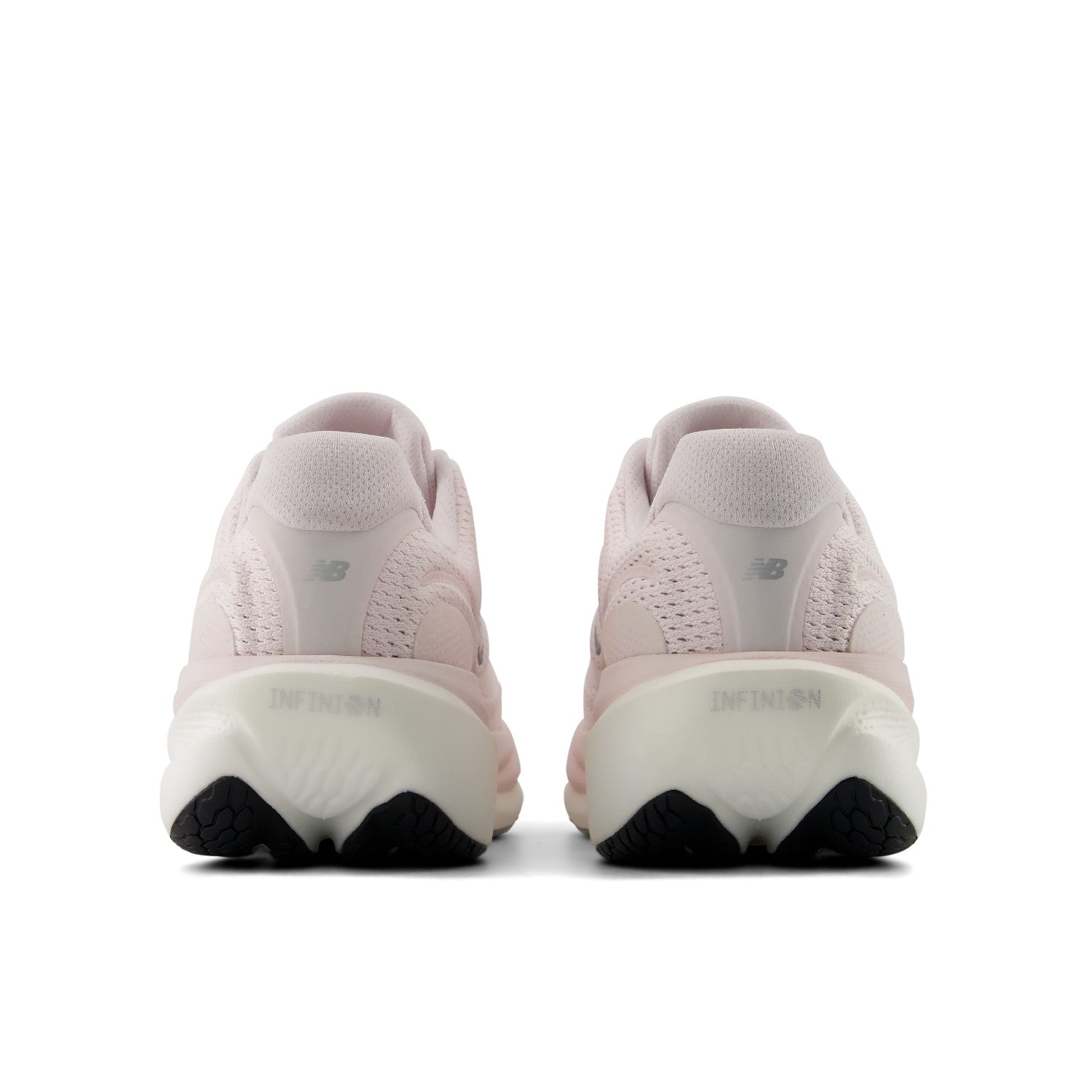 Pair of pink running shoes with a white sole on a white background