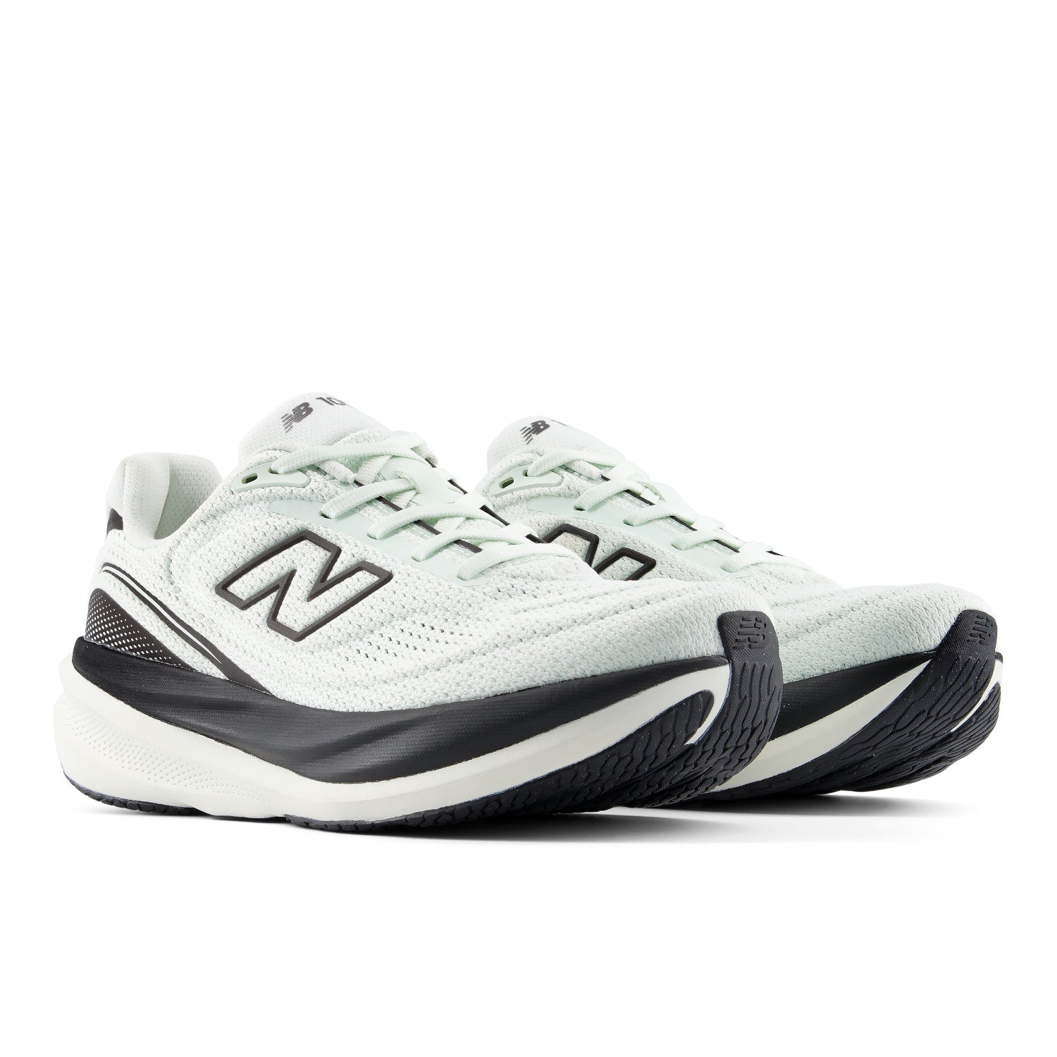 A pair of New Balance running shoes in white and light mint green with black accents, shown from a side profile view on a white background.