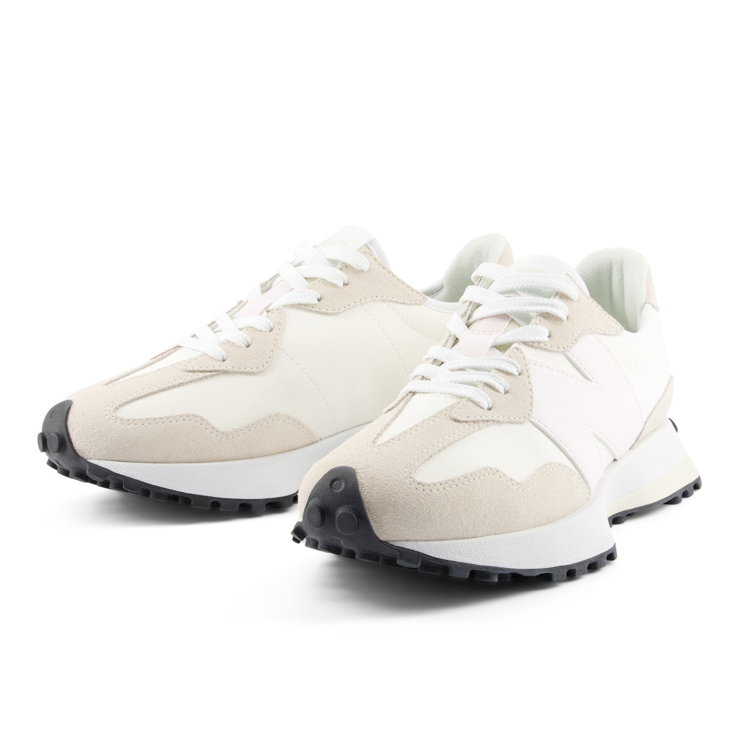 Pair of beige and white sneakers on a white background