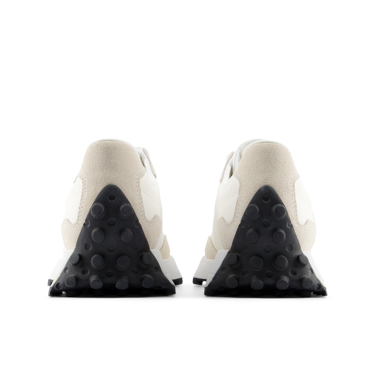 Back view of white sneakers with black sole on a white background