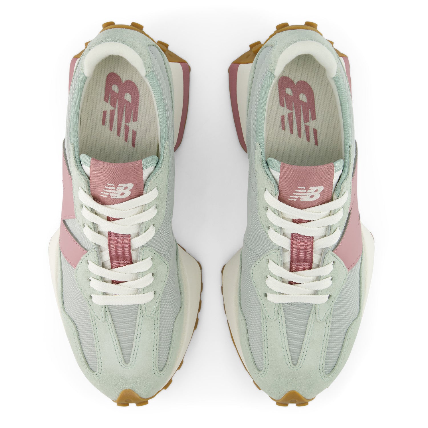 Pair of pastel green and pink New Balance sneakers on a white background