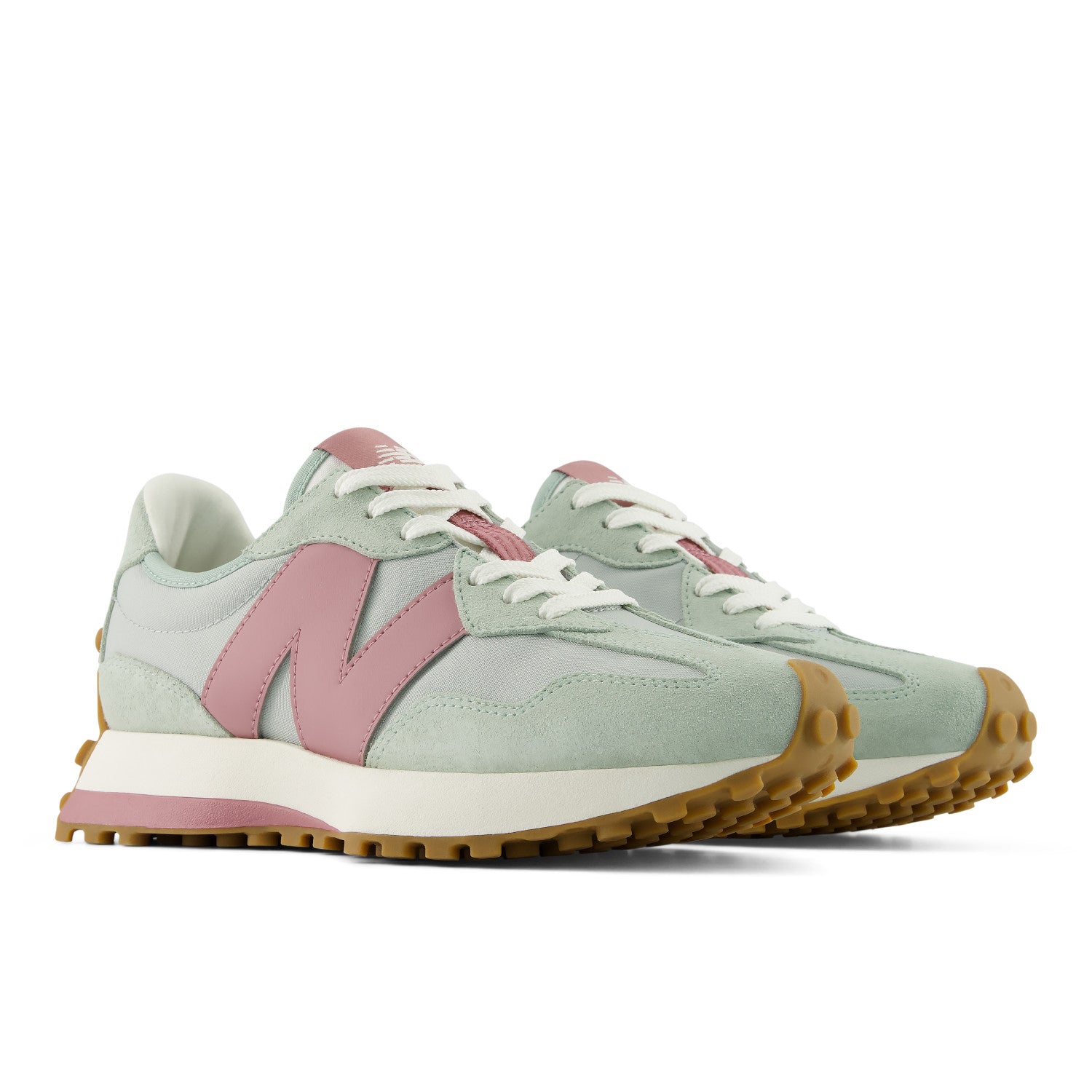 Pair of light green and pink sneakers with white laces on a white background