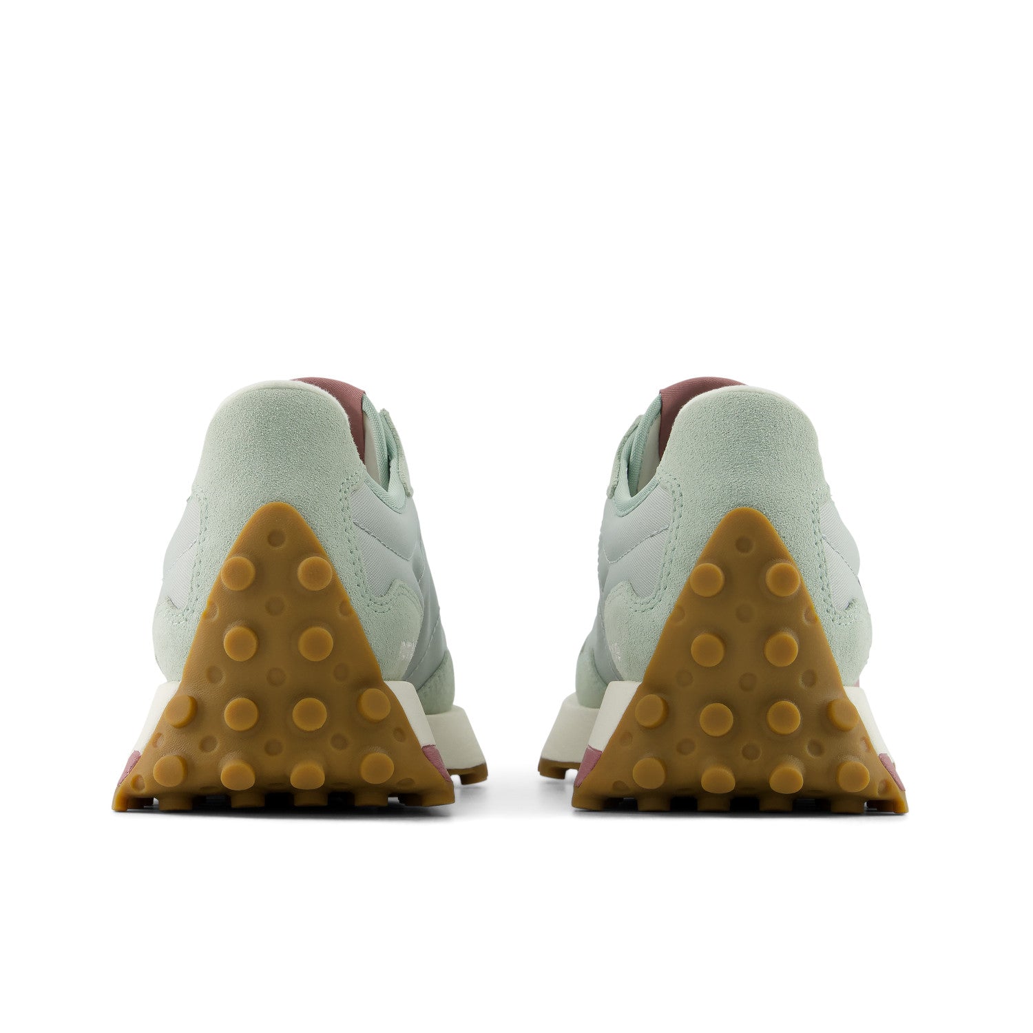 Pair of shoes showing the sole with brown rubber outsole on a white background