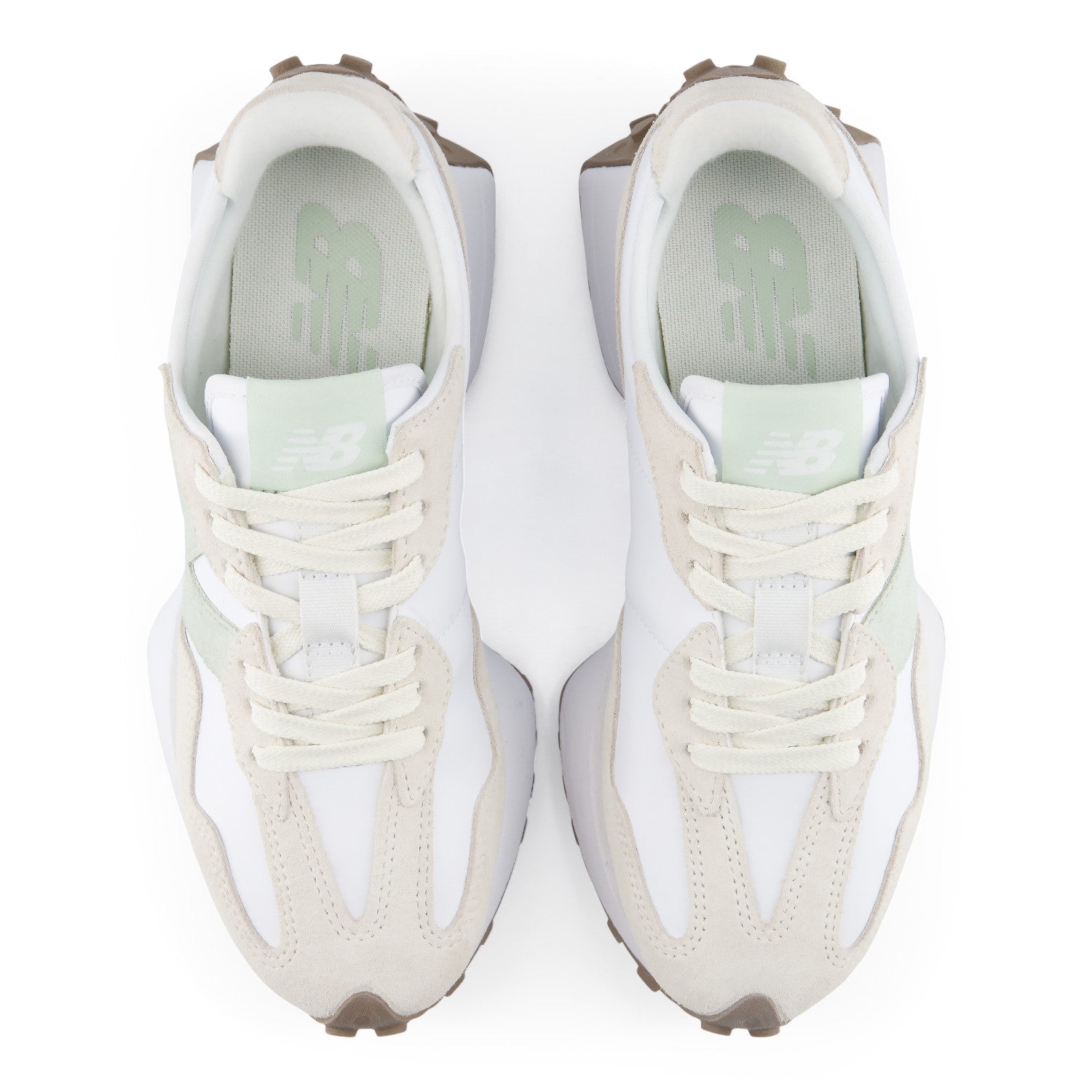Pair of white sneakers with brown accents on a white background