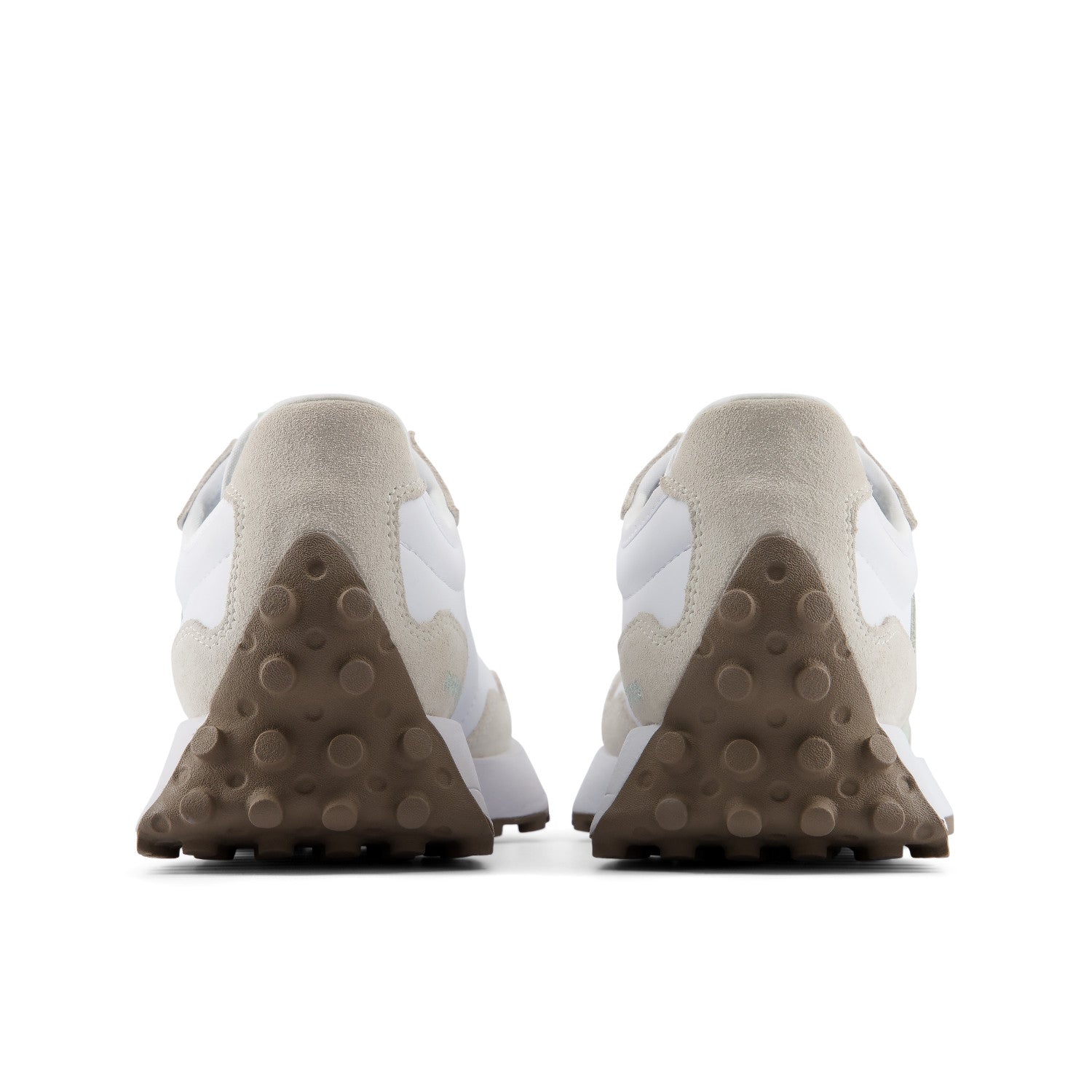 Pair of beige sneakers with white accents on a white background