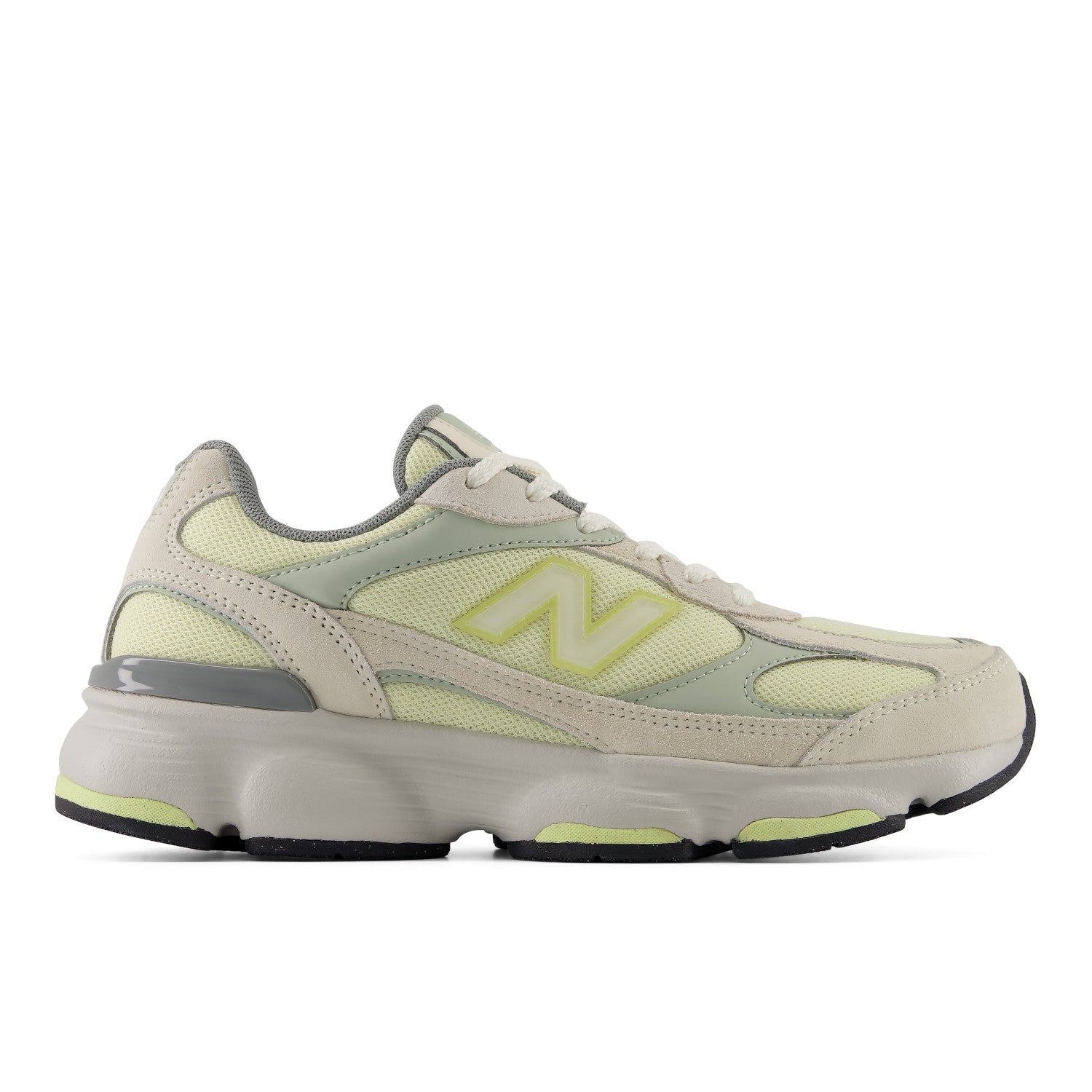 Beige and green sneaker with New Balance logo on a white background