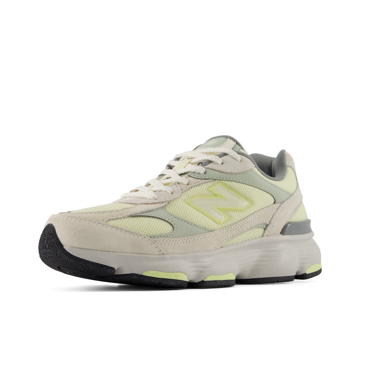 Beige and green sneaker with New Balance logo on a white background