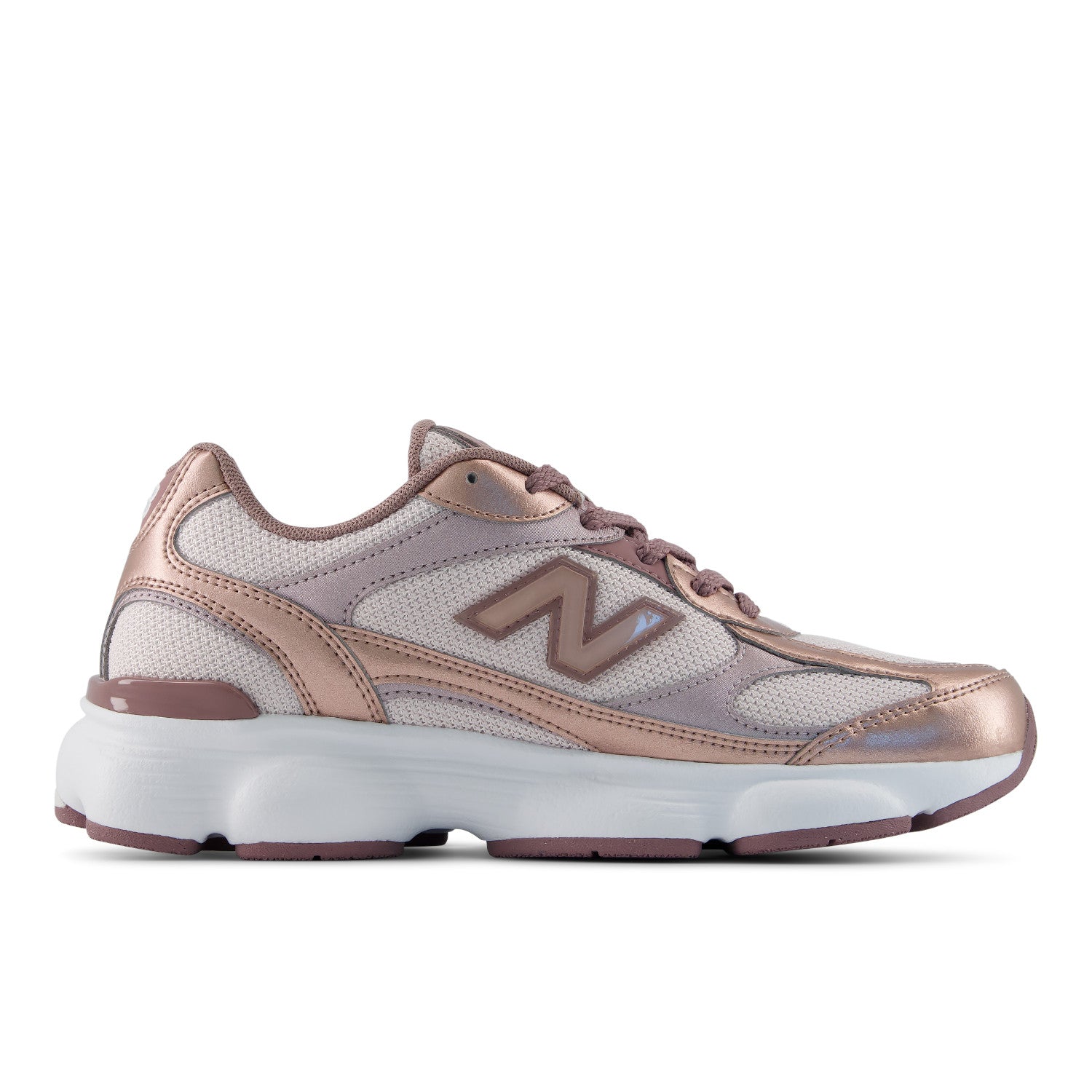 A New Balance sneaker in metallic rose gold and white, shown from the side profile against a plain white background.