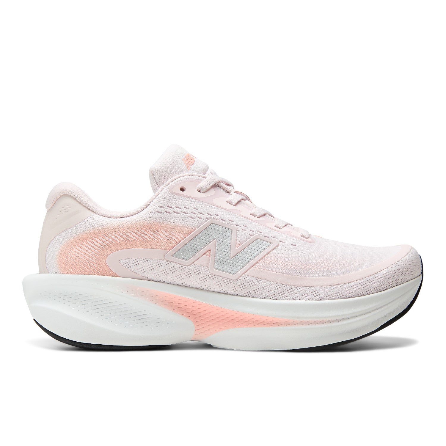 A New Balance running shoe in light pink and white with a peach-pink accent on the midsole and logo, shown from a side profile on a white background.