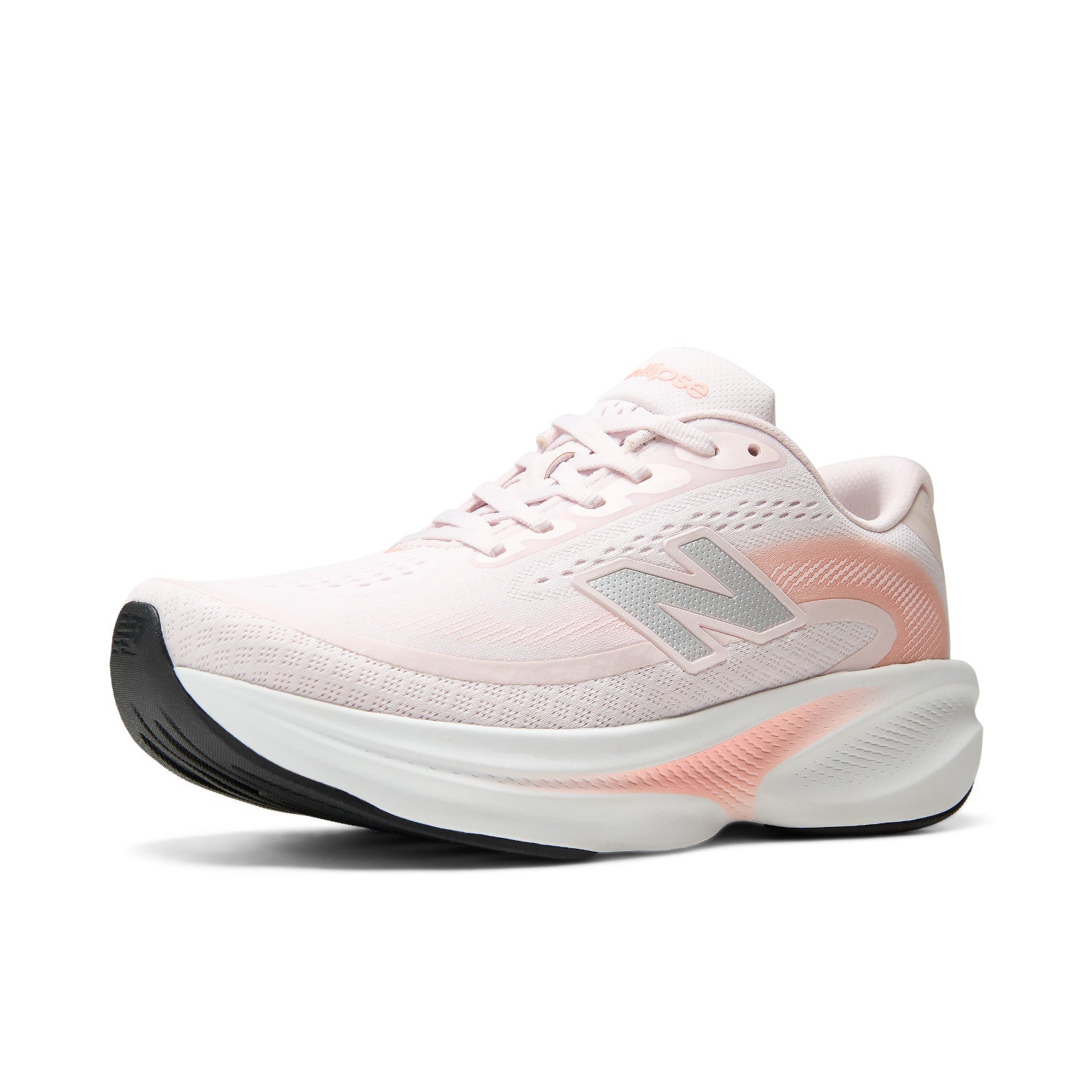 A New Balance running shoe in light pink and white with a peach-pink heel accent, a gray 'N' logo, and a thick white and black midsole, shown on a clean white background.