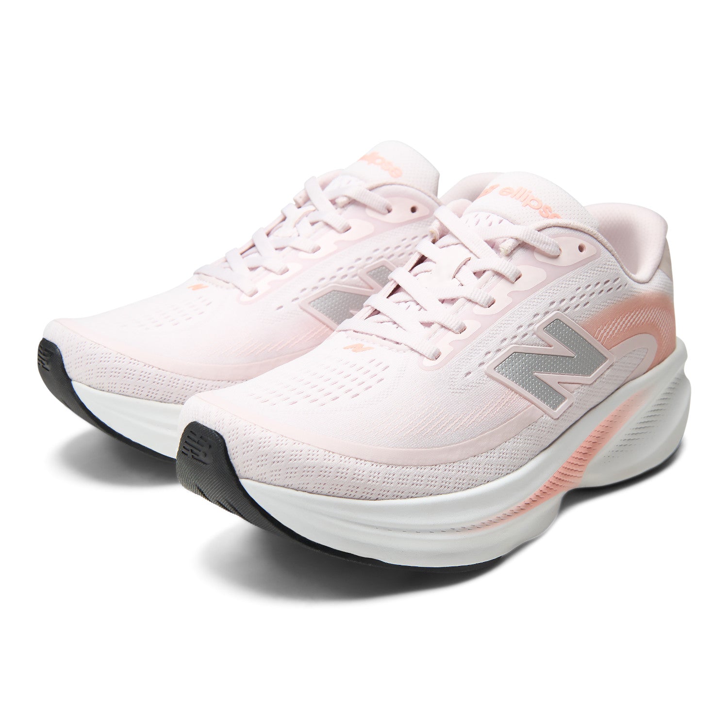 A pair of New Balance running shoes in light pink with white midsoles, gray 'N' logos, and subtle peach accents, shown on a clean white background.