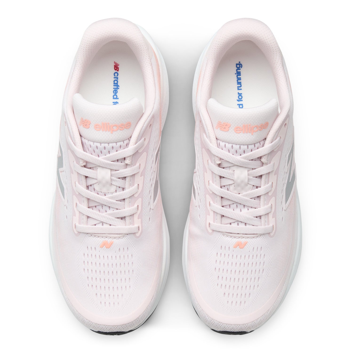 A pair of New Balance Ellipse running shoes in light pink and white, shown from a top-down view on a clean white background.